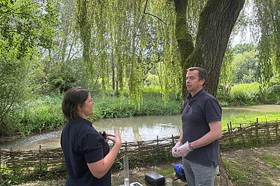 Calum Miller MP at Combe performing a water survey with local river quality groups.