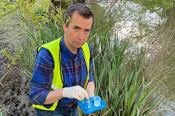 Calum Miller testing the River Ray in Oxfordshire for sewage bacteria